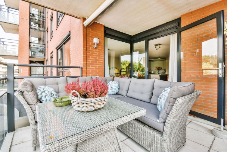 balcony-with-a-large-wicker-gray-armchair-2025-02-10-12-58-09-utc